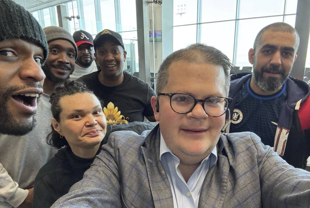 LUCID's founder with a group of freed Americans on their flight home from Kuwait